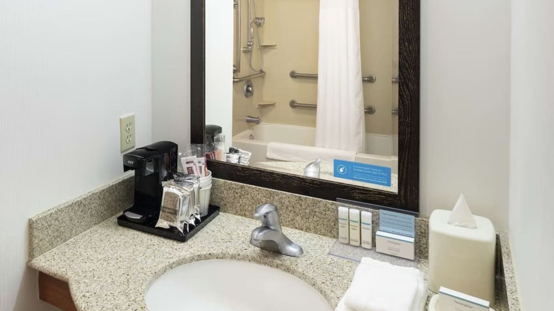 Private guest bathroom with combined shower and tub at Hampton Inn & Suites Clovis-Airport North.