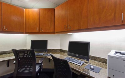 Business center with computers, printer and ergonomic chairs at Hampton Inn & Suites Clovis-Airport North.