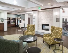 Lobby lounge with fireplace at Homewood Suites By Hilton Fresno Airport/Clovis.