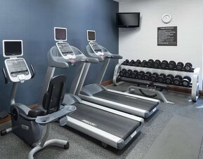 Well equipped fitness center at Homewood Suites By Hilton Fresno Airport/Clovis.