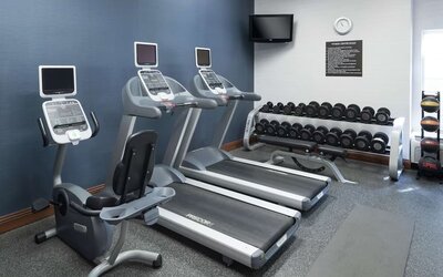 Well equipped fitness center at Homewood Suites By Hilton Fresno Airport/Clovis.