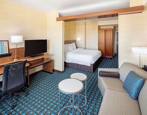 King room with work desk and TV at Fairfield Inn & Suites By Marriott North Bergen.