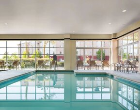 Indoor pool with lounge chairs at DoubleTree By Hilton San Francisco Airport North Bayfront.