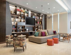 Lobby lounge and workspace at Tru By Hilton Denver Downtown Convention Center.