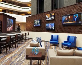 Lobby lounge and workspace at Embassy Suites By Hilton Los Angeles-Intl Airport North.