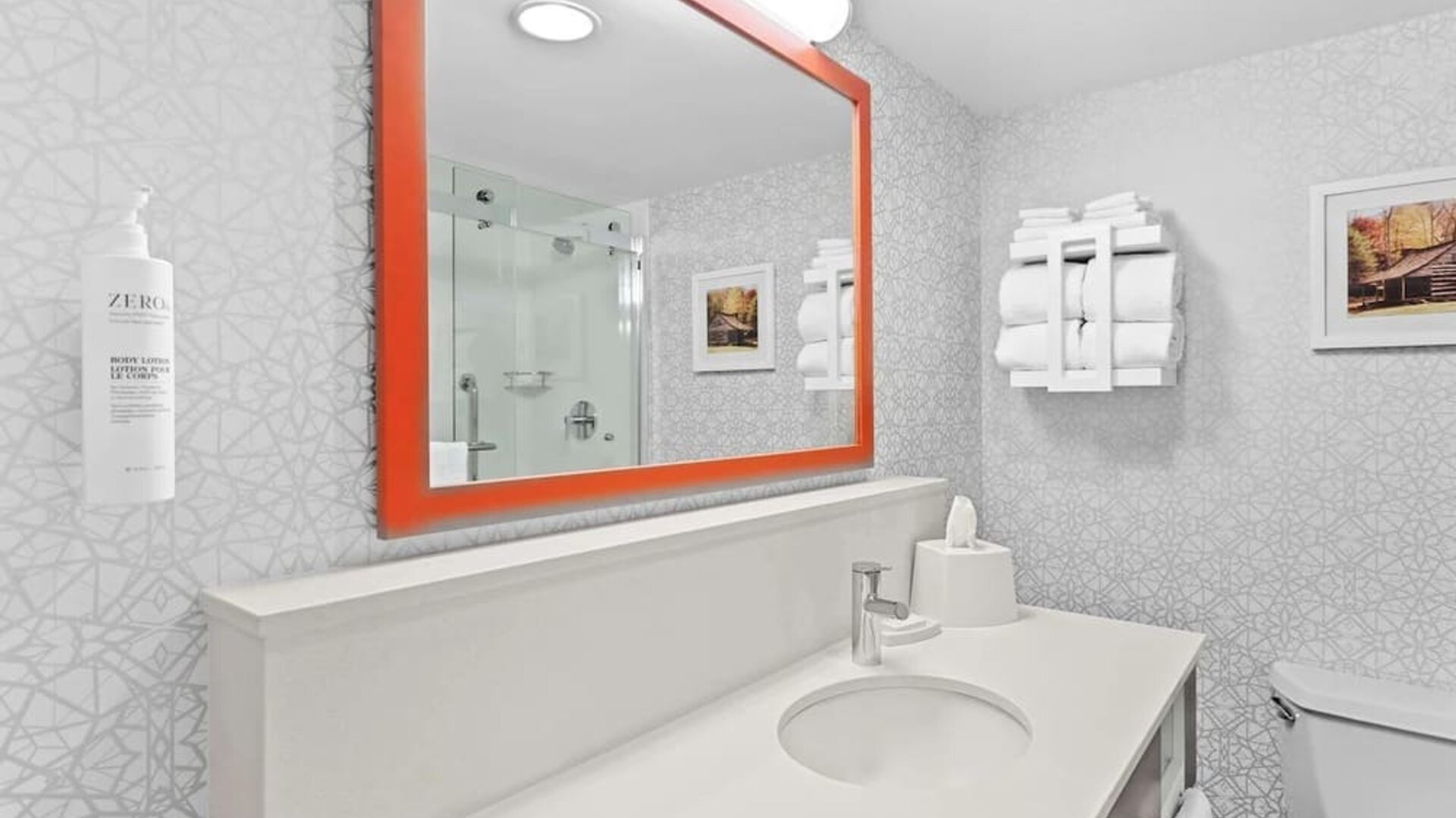 Private guest bathroom with free toiletries at Hampton Inn Chicago/Naperville.