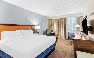 Bright and spacious day use room with work desk at Hampton Inn Chicago/Naperville.