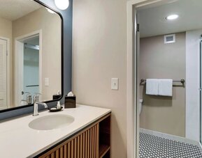 Private guest bathroom with shower and free toiletries at Sonesta Select Scottsdale At Mayo Clinic Campus.