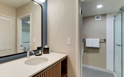 Private guest bathroom with shower and free toiletries at Sonesta Select Scottsdale At Mayo Clinic Campus.