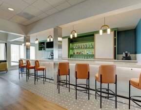 Hotel bar with lounge seating at Sonesta Select Scottsdale At Mayo Clinic Campus.