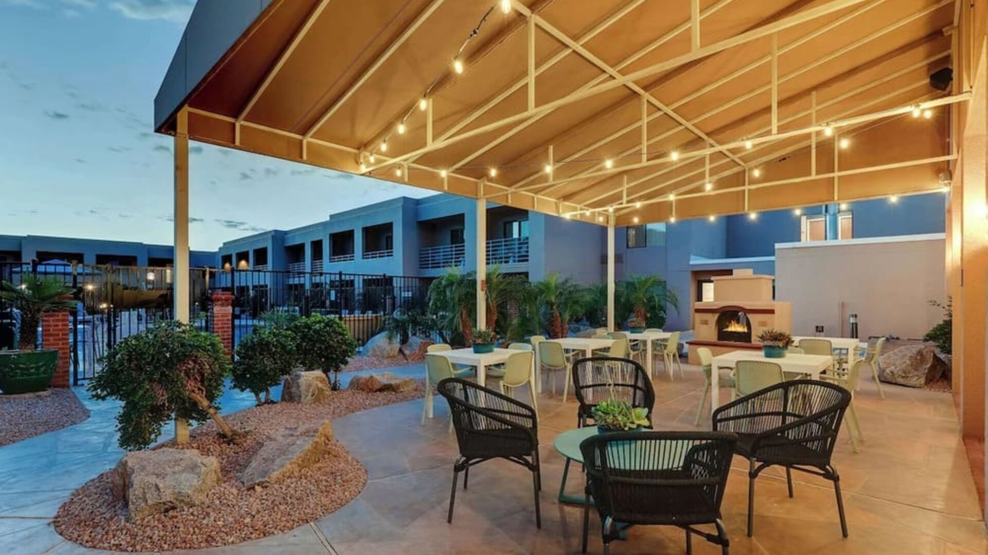 Hotel patio with comfortable seating and fireplace at Sonesta Select Scottsdale At Mayo Clinic Campus.