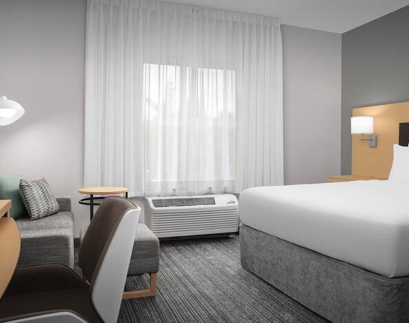 Day use room with sofa and work desk at TownePlace Suites Franklin Cool Springs.