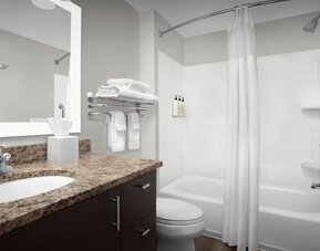 Guest bathroom with shower and tub at TownePlace Suites Franklin Cool Springs.