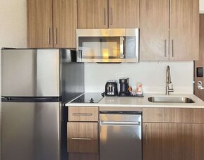 In-room kitchen available at MainStay Suites Oak Brook Terrace - Chicago.