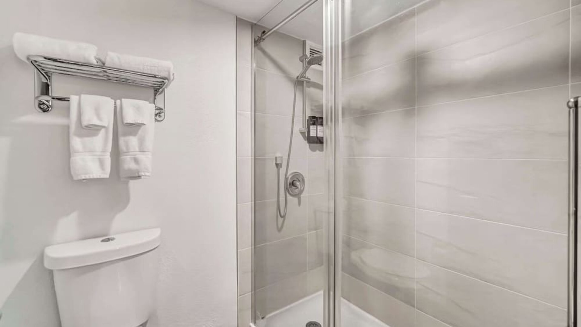 Private guest bathroom with shower at Radisson Hotel Schaumburg.