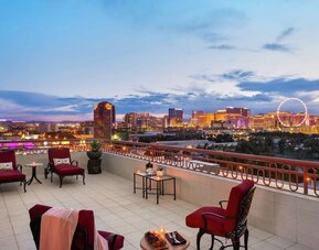 Rooftop terrace with lounge seating at Embassy Suites By Hilton Convention Center Las Vegas.