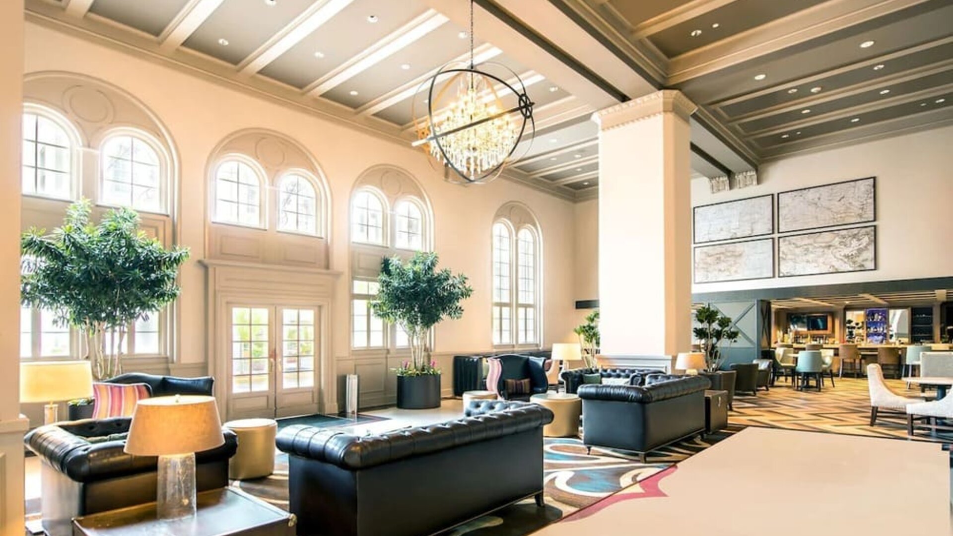 Hotel lobby with comfortable seating and workspace, perfect for coworking at Hilton Baton Rouge Capitol Center.