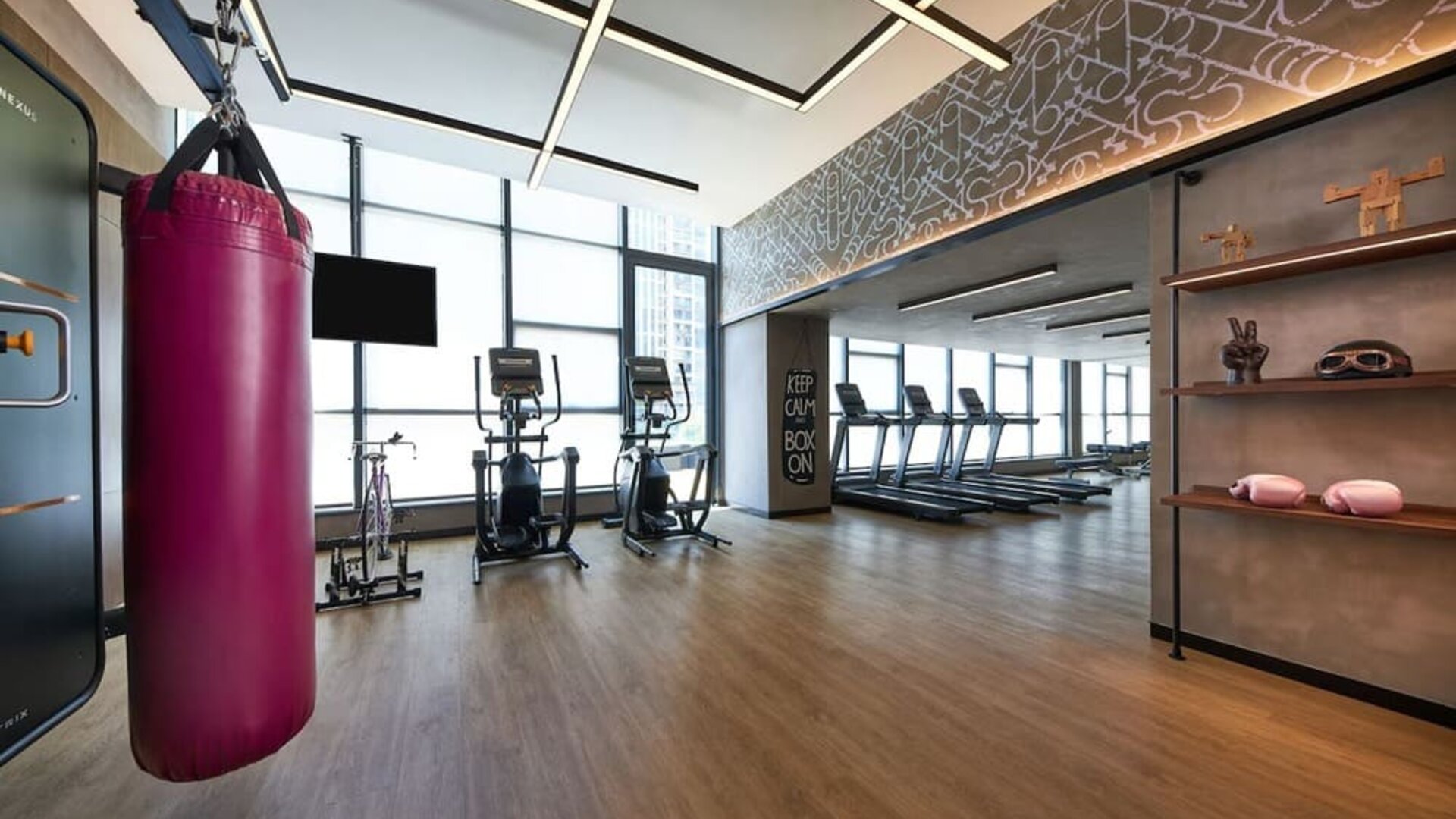 Fitness center with natural light at Moxy Boston Downtown.