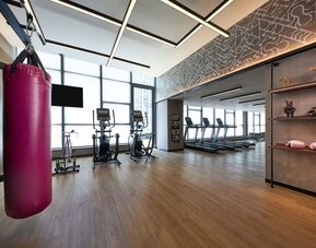 Fitness center with natural light at Moxy Boston Downtown.