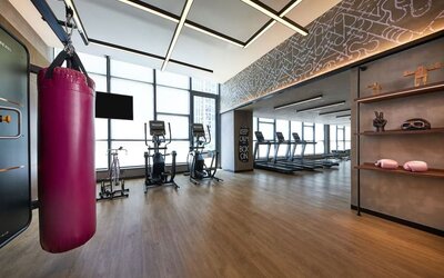 Fitness center with natural light at Moxy Boston Downtown.