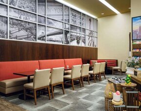 Dining area perfect for coworking at Hilton Garden Inn New York/West 35th Street.
