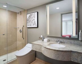 Private guest bathroom with shower at Hilton Garden Inn New York/West 35th Street.
