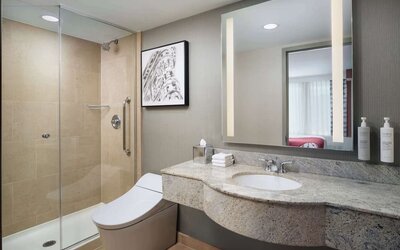 Private guest bathroom with shower at Hilton Garden Inn New York/West 35th Street.
