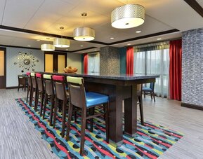 Dining area and workspace at Hampton Inn Iowa City/University Area.