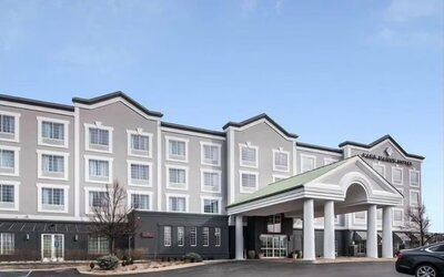 Exterior and parking area at Park Manor Hotel.