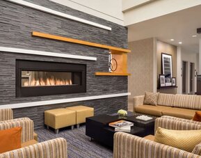Lobby lounge with fireplace at Hampton Inn & Suites Rosemont Chicago O'Hare..