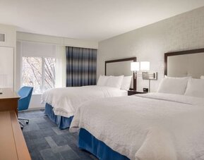 Day use twin room with work desk at Hampton Inn & Suites Rosemont Chicago O'Hare.