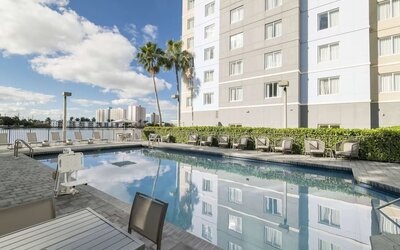 Stunning outdoor pool at Homewood Suites By Hilton Miami Airport-Blue Lagoon.
