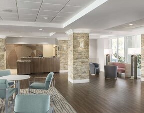 Lobby and coworking lounge at Homewood Suites By Hilton Miami Airport-Blue Lagoon.