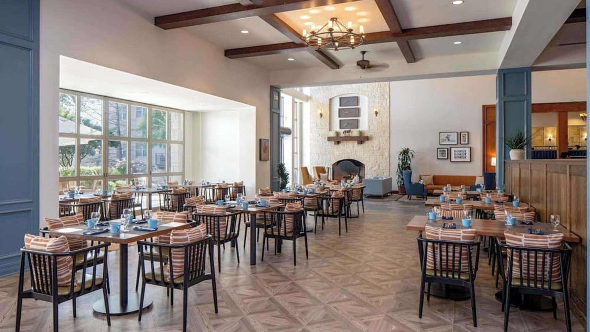 Dining area with natural light perfect for coworking at Hilton San Antonio Hill Country.