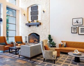 Lobby and coworking lounge at Hilton San Antonio Hill Country.