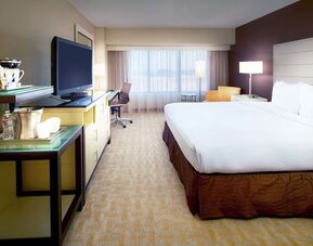 Day use room with work desk and natural light at Hilton Los Angeles Airport.
