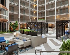 Lobby lounge and workspace at Embassy Suites By Hilton Arcadia Pasadena Area.