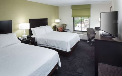 Day use twin room with work desk at Hampton Inn & Suites Gainesville-Downtown.