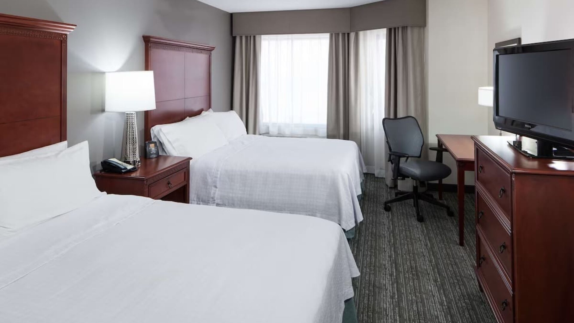 Day use twin room with work desk at Homewood Suites By Hilton Denton. 