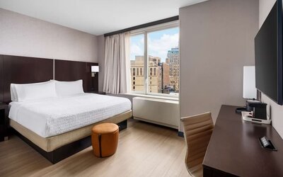 Bright and spacious day use room with work desk at Hampton Inn Manhattan/Times Square Central.