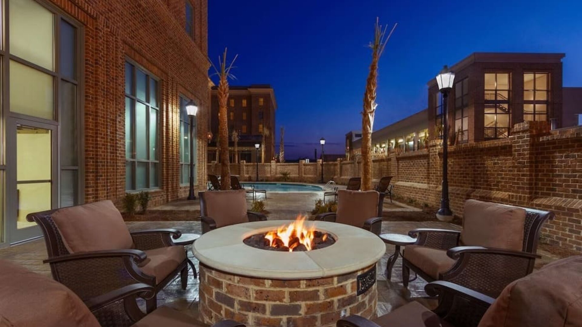 Outdoor seating and fire pit at Embassy Suites By Hilton Savannah.