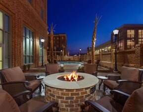 Outdoor seating and fire pit at Embassy Suites By Hilton Savannah.
