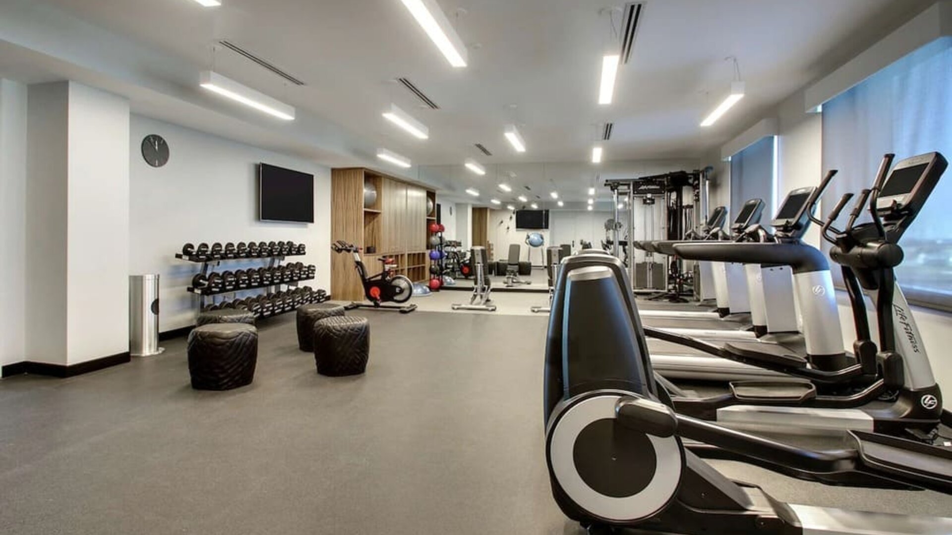 Well equipped fitness center at The Rose Hotel Chicago O’Hare, Tapestry Collection By Hilton.