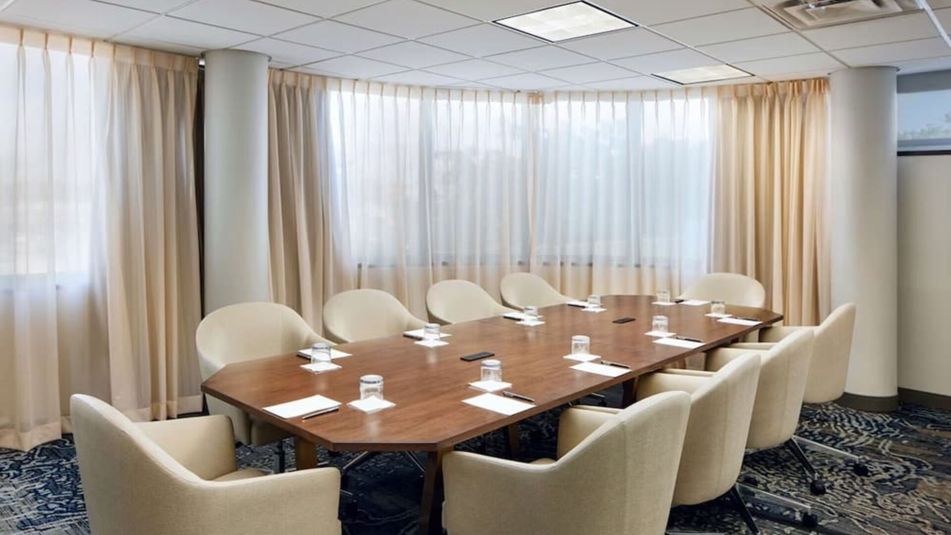 Professional meeting room with comfortable seating at Embassy Suites By Hilton West Palm Beach Central.