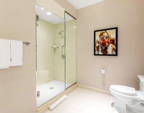 Private guest bathroom with shower and free toiletries at The Chicago Hotel Collection - Magnificent Mile.