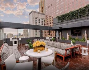 Rooftop terrace with lounge seating at The Chicago Hotel Collection - Magnificent Mile.
