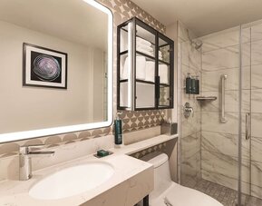 Private guest bathroom with shower and free toiletries at DoubleTree By Hilton New York Midtown Fifth Ave.