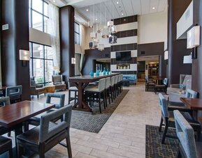 Dining area with comfortable seating, perfect for coworking at Hampton Inn & Suites Trophy Club - Fort Worth North, TX.