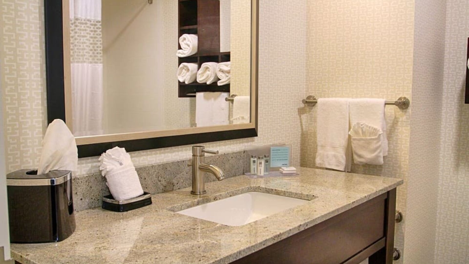 Private guest bathroom with shower and free toiletries at Hampton Inn & Suites Trophy Club - Fort Worth North, TX.