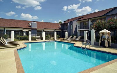 Outdoor pool with lounge chairs at Sonesta Select Atlanta Norcross I-85.